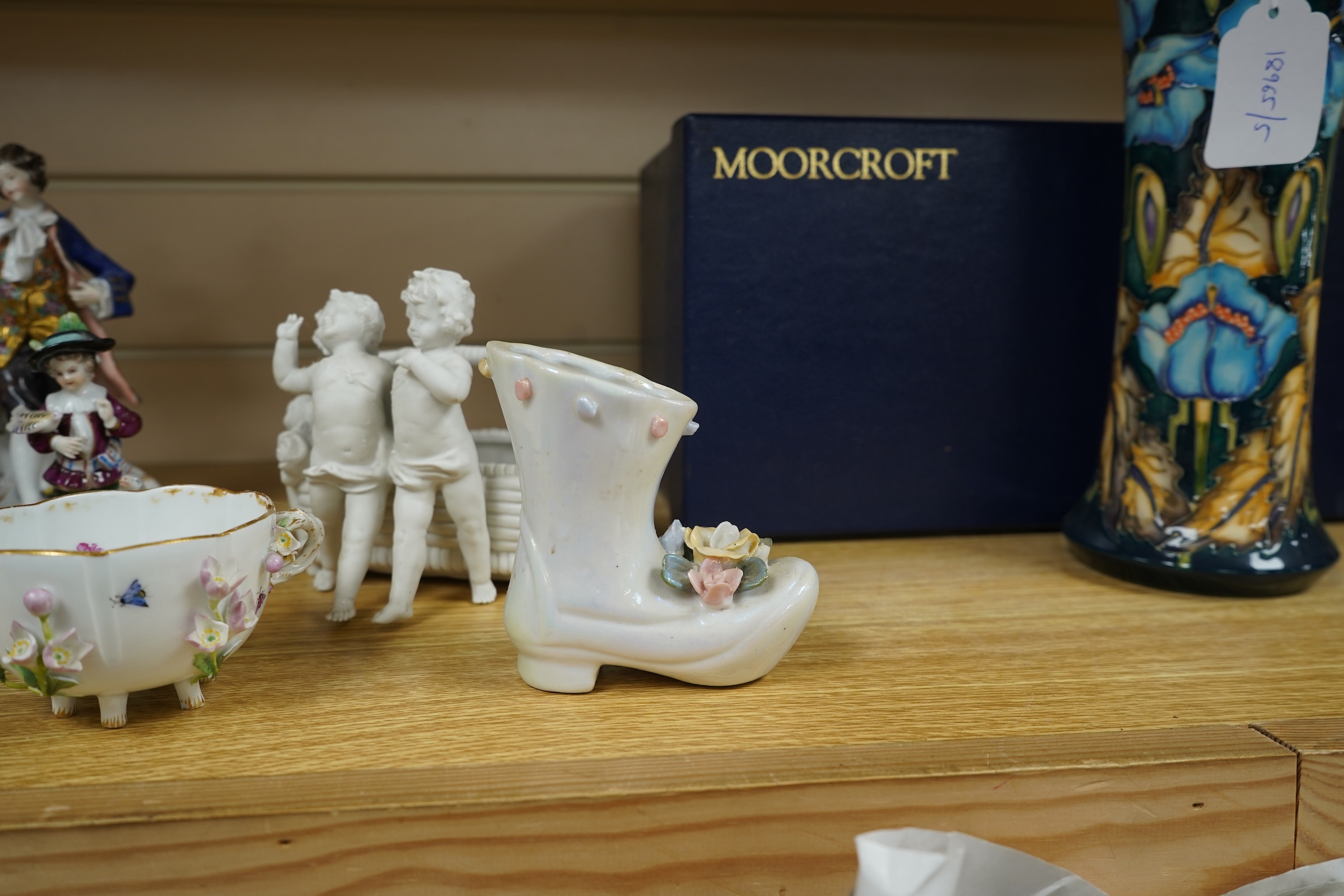 A French porcelain figure of a Mansion House dwarf, various German porcelain figures, an engraved glass and bowl. Glass 19cm